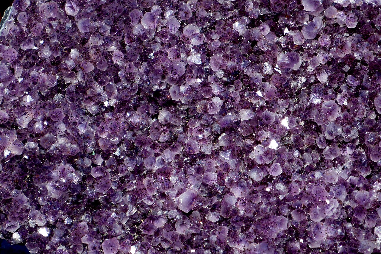 Amethyst crystals representing crystal healing guidance and wellness consultation